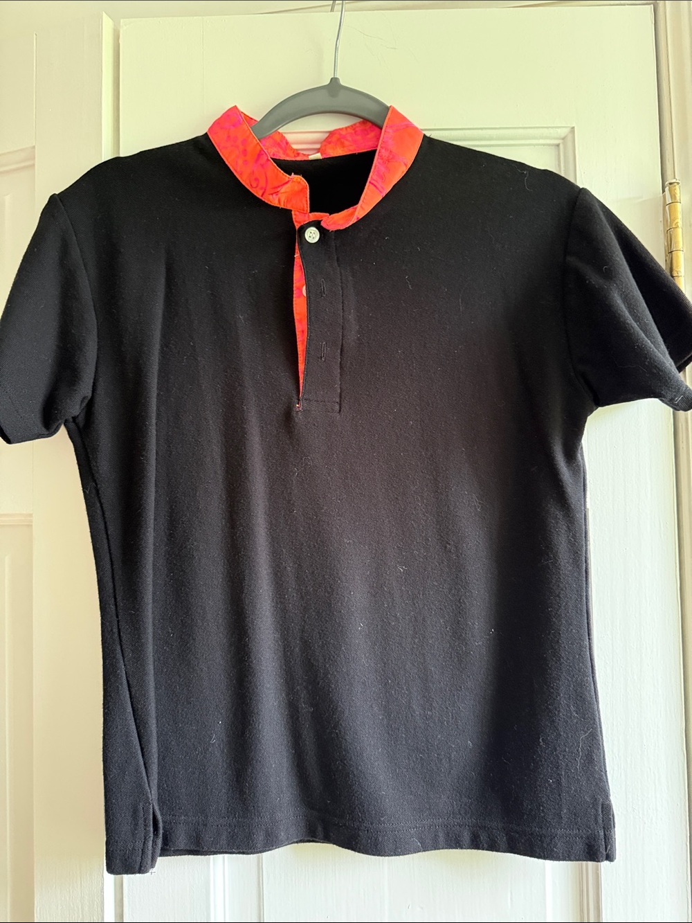 Black Short Sleeve Top with Bright Pink-Orange Trim